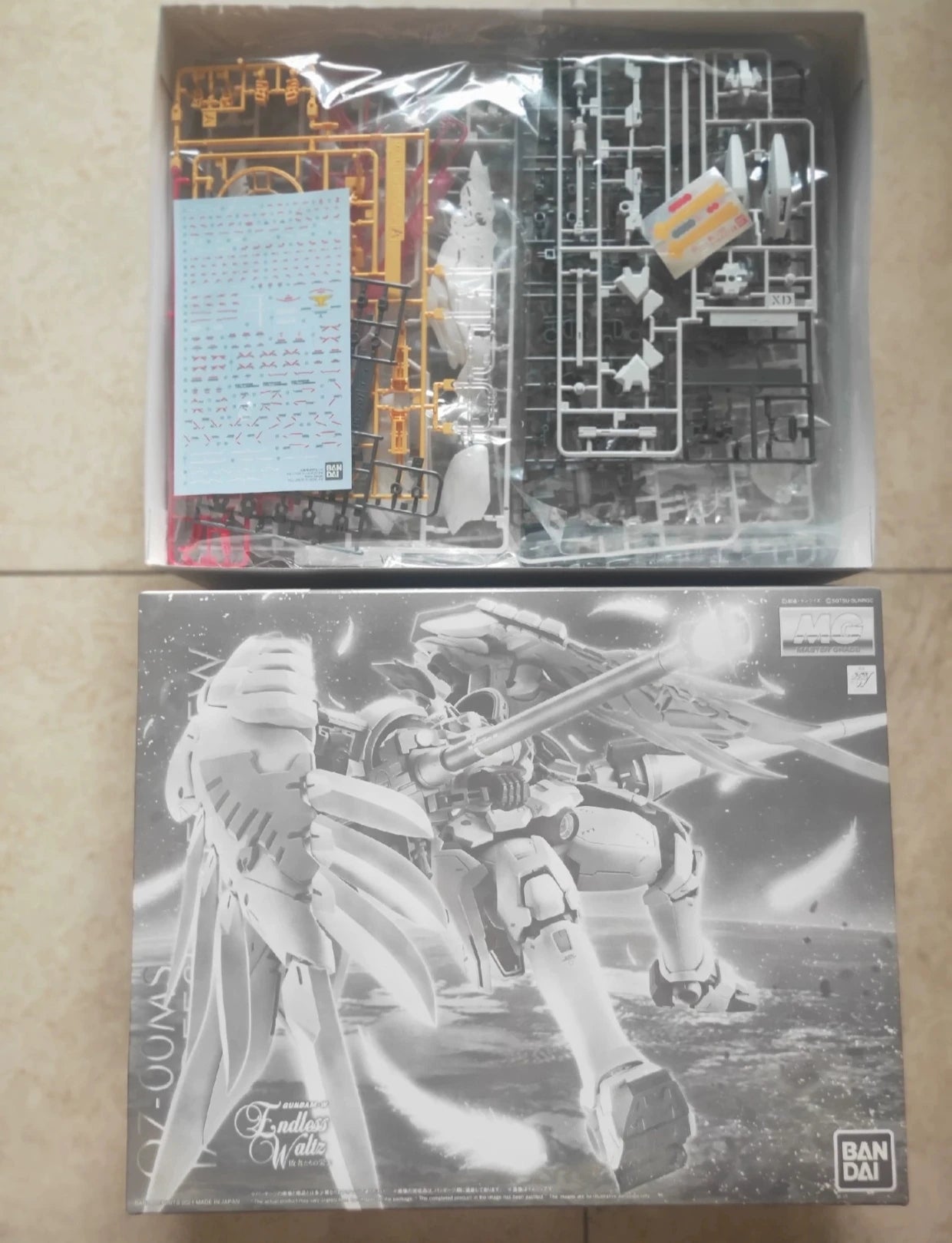 Bandai MG 1/100 pb limit GUNDAM OZ-00MS TALLGEESE FLUEGEL EW model Kit Anime Action Fighter assembly model toy gift for kids
