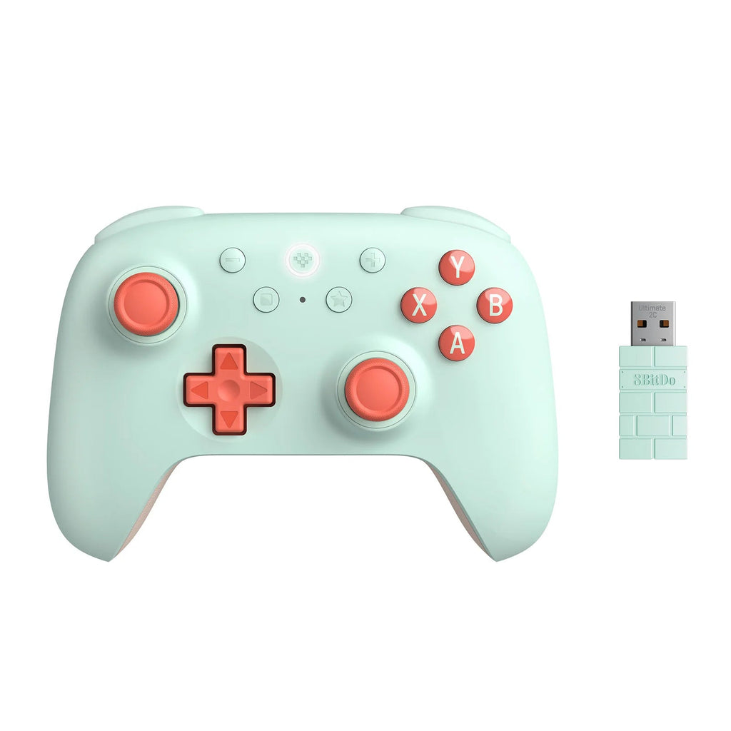 Mint green gaming controller with red buttons and a wireless USB adapter on a white background.