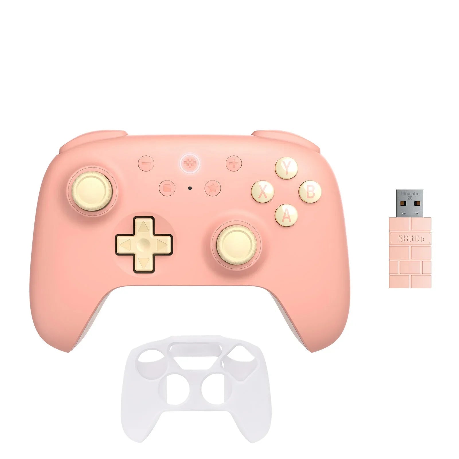 Pink gaming controller with gold accents and a USB adapter on a white background