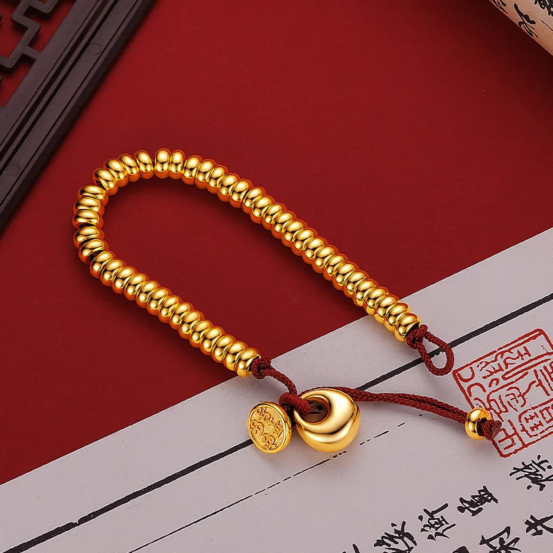 Männer und Frauen 9999 24K Echtgold Neue chinesische glatte Goldklumpen Frieden Freude Geld gewickeltes rotes Seilarmband Einfacher China-Chic